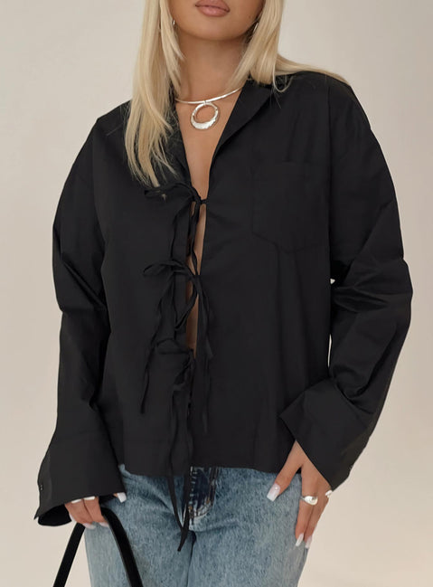 front view of model wearing Princess Polly Spiri Shirt Black Full Sleeves V-Neck 