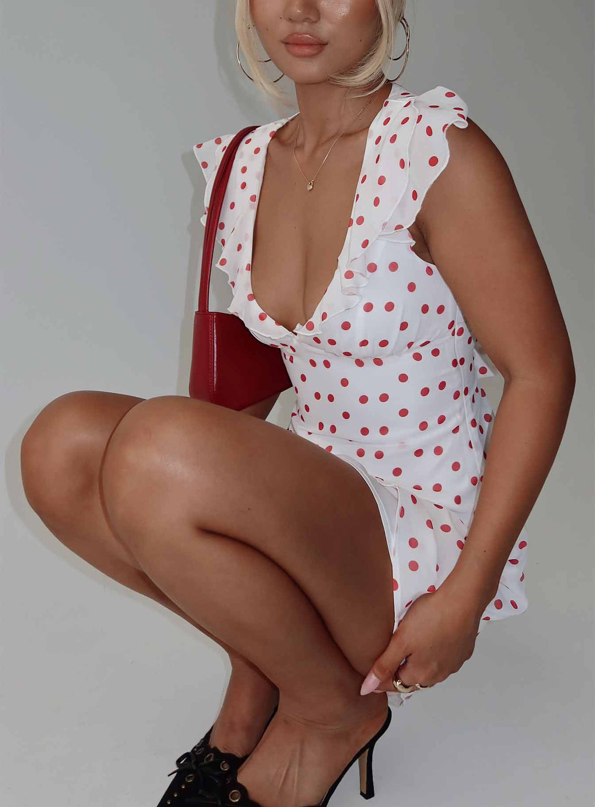 side view of model wearing Princess Polly I Guess So Mini Dress White / Burgundy Plunger 