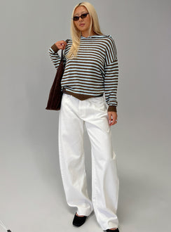 side view of model wearing Princess Polly Kaio Mid Rise Barrel Leg Denim Jeans White Mid Rise Jeans Jeans 