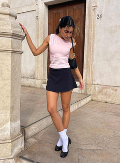 side view of model wearing Princess Polly Reema Skort Black High Waisted Shorts 
