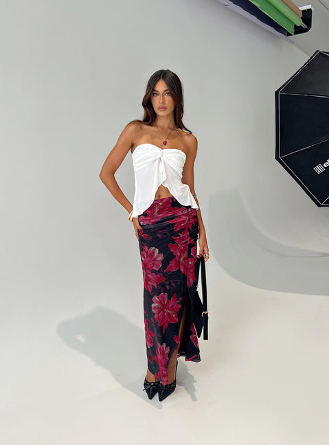   side view of model wearing Princess Polly Cooperi Maxi Skirt Black / Red Floral Maxi 
