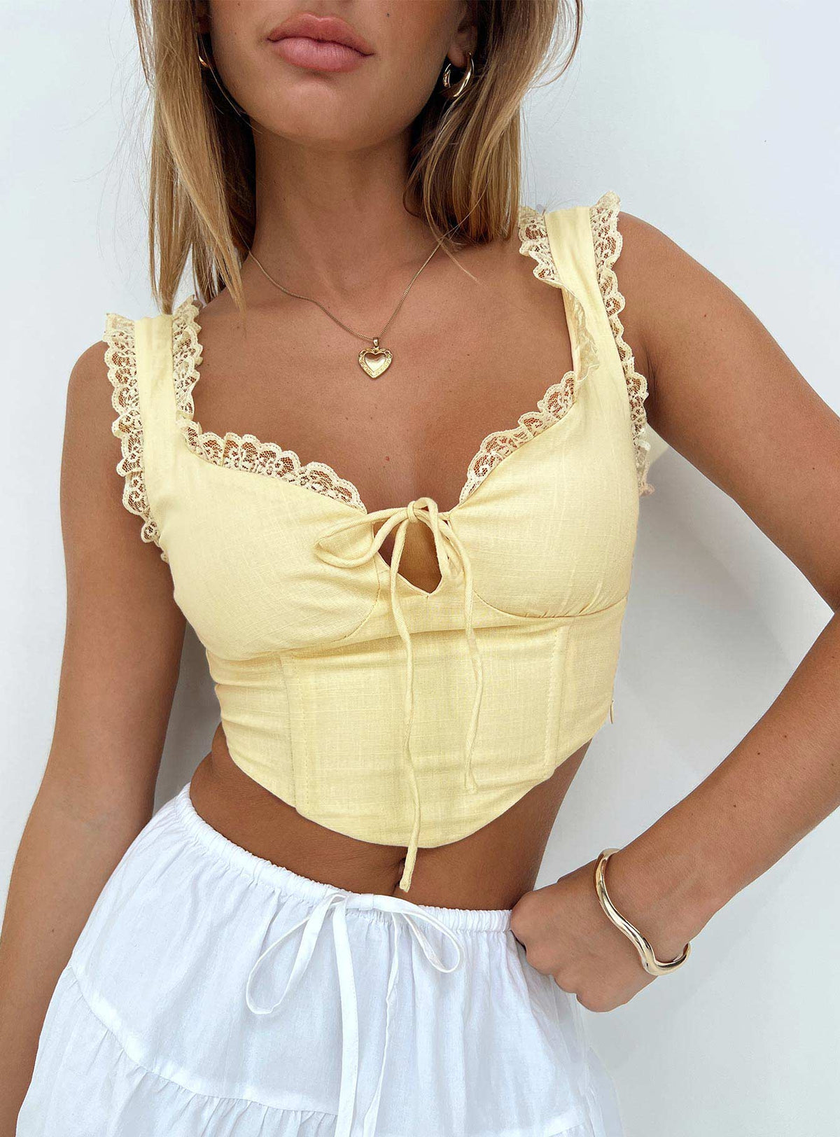 side view of model wearing Princess Polly Scarlett Top Yellow Sleeveless Sweetheart 