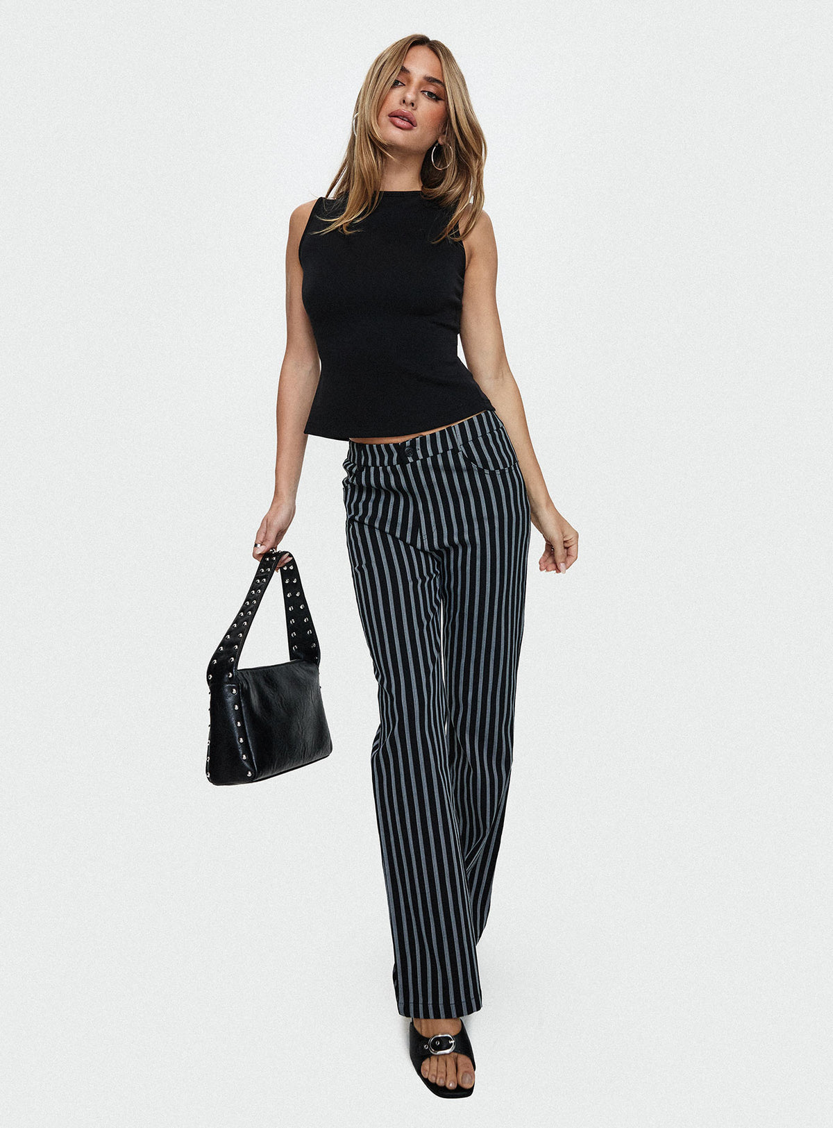 front view of model wearing Princess Polly Allude Low Waist Pinstripe Pant Black Low Rise Pants Pants 