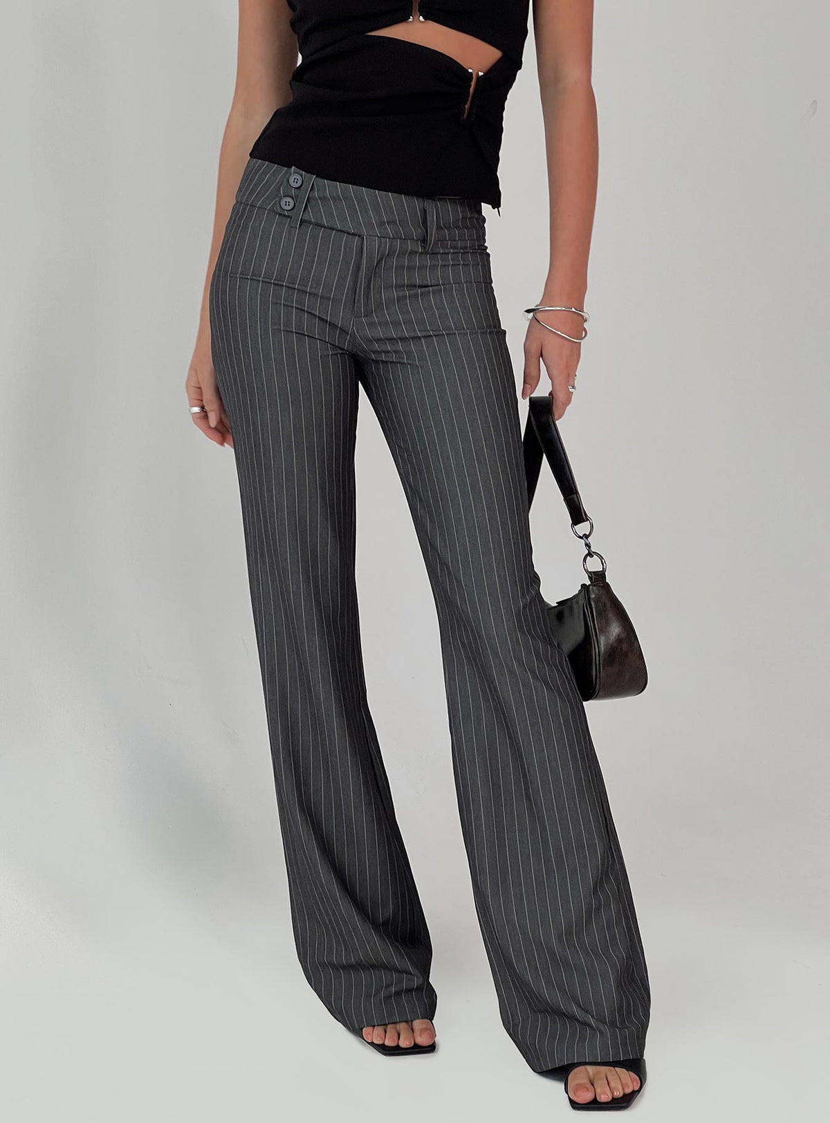 back view of model wearing Princess Polly Kinkirk Flared Pants Grey Pinstripe Tall Low Rise Pants Pants 
