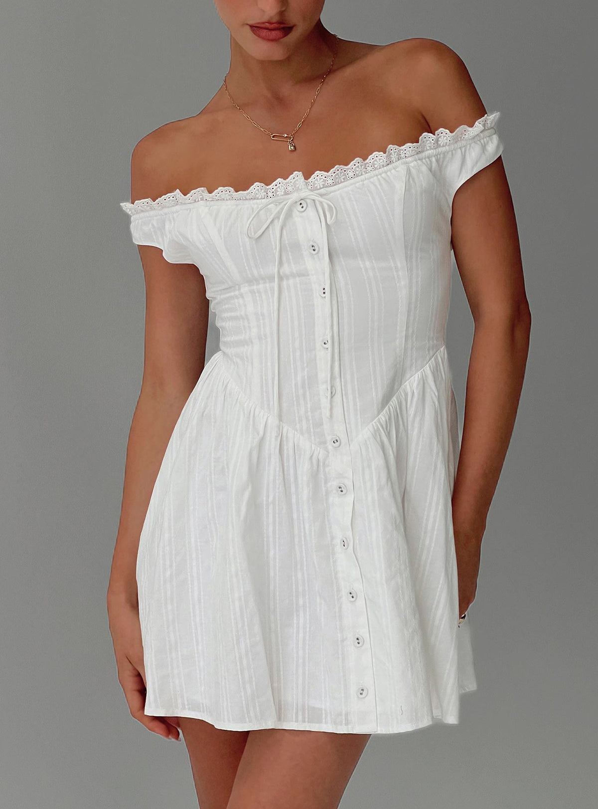 side view of model wearing Princess Polly White Horse Off The Shoulder Mini Dress White Straight Neck 