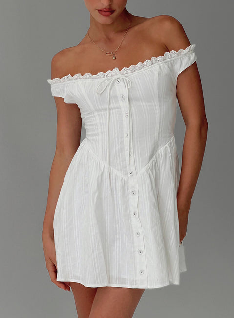 side view of model wearing Princess Polly White Horse Off The Shoulder Mini Dress White Straight Neck 