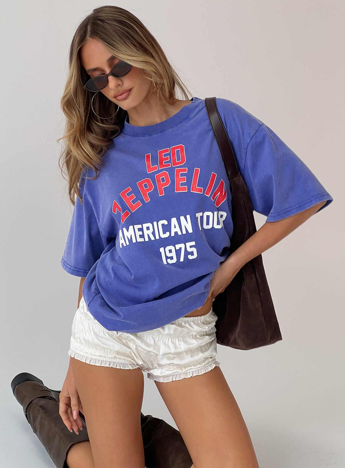 front view of model wearing Princess Polly Led Zeppelin Vintage Oversized Graphic Tee Blue Half Sleeves Crew Neck 