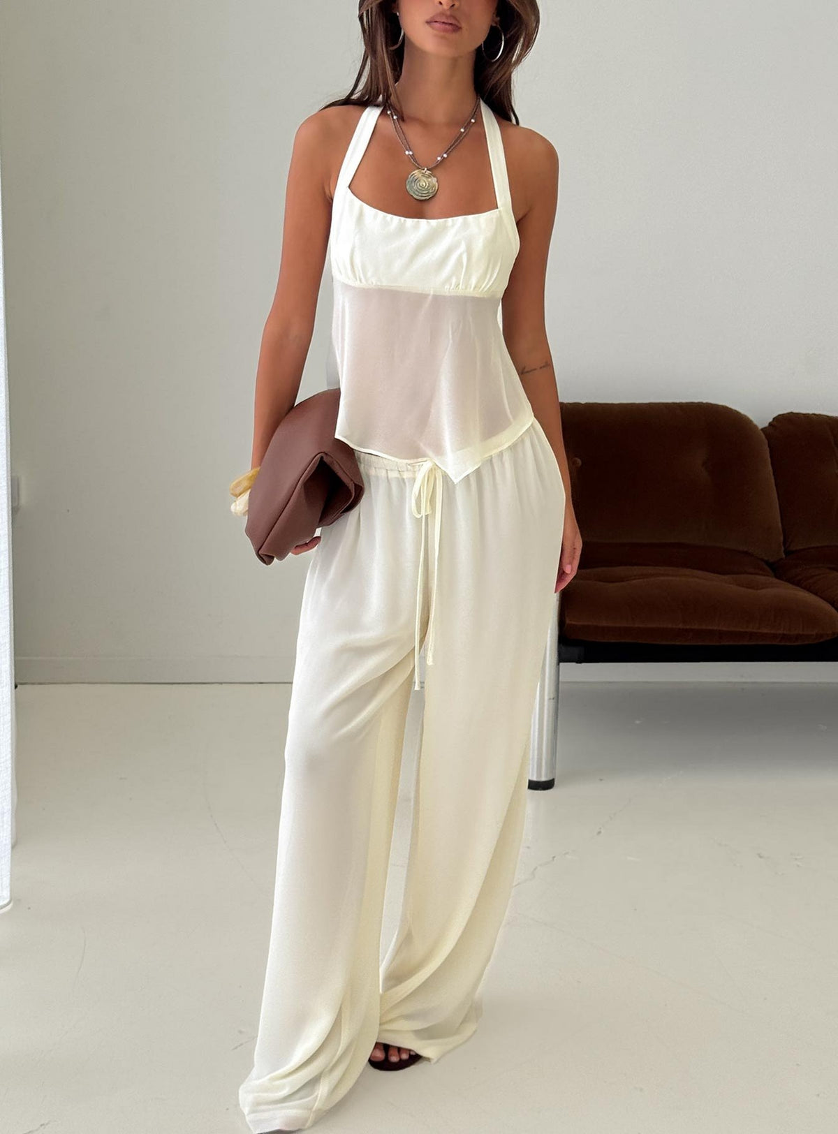 Showcasing the Finesse Pants Yellow womens-regular-pants with mid-rise front view of model wearing Princess Polly