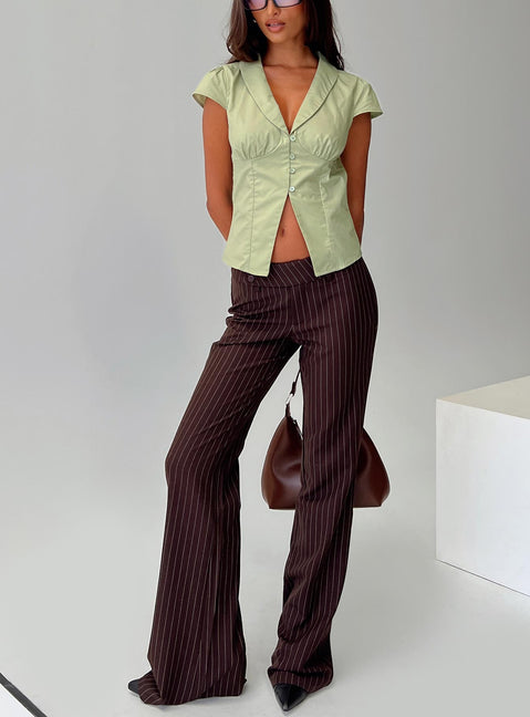 front view of model wearing Princess Polly Kinkirk Flared Pants Brown Pinstripe Low Rise Pants Pants 