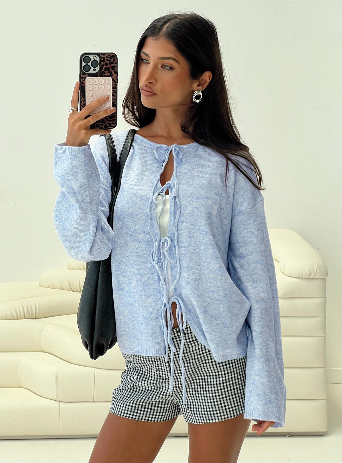 side view of model wearing Princess Polly Frosty Knit Cardigan Blue Longline Jumpers Jumpers 