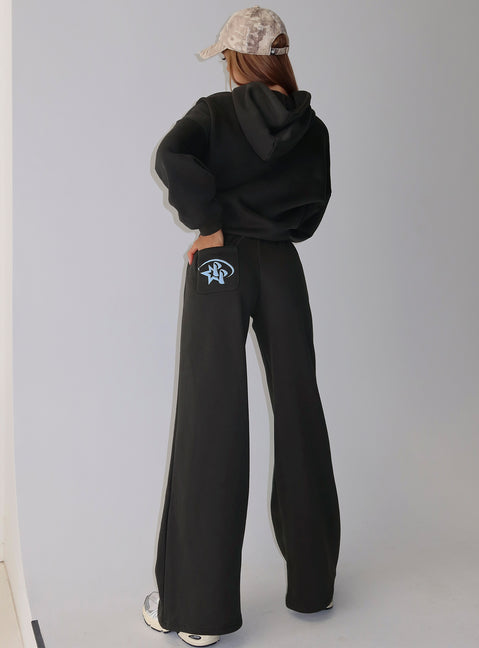 back view of model wearing Princess Polly Princess Polly Stargirl Wide Leg Sweat Pants Charcoal High Rise Pants Pants 
