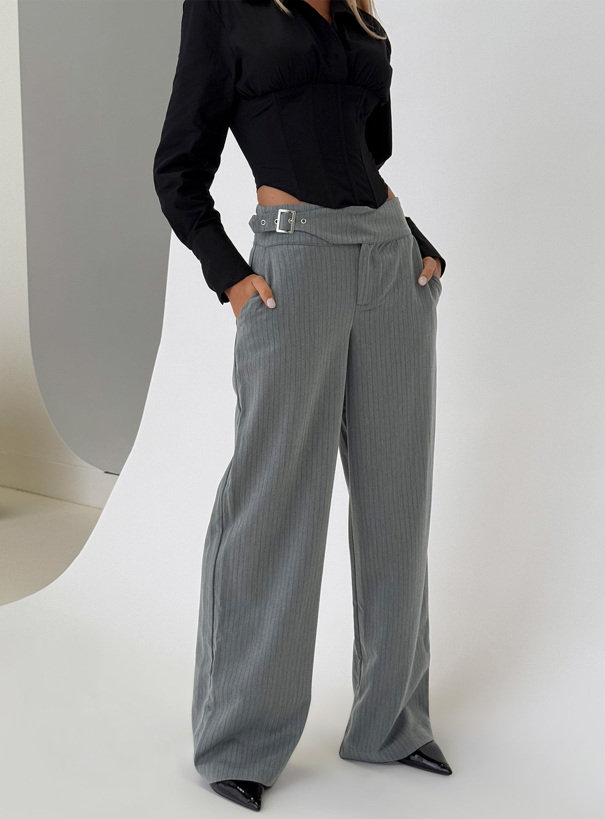 back view of model wearing Princess Polly Jinny Relaxed Buckle Tailored Pants Grey Pinstripe Low Rise Pants Pants 