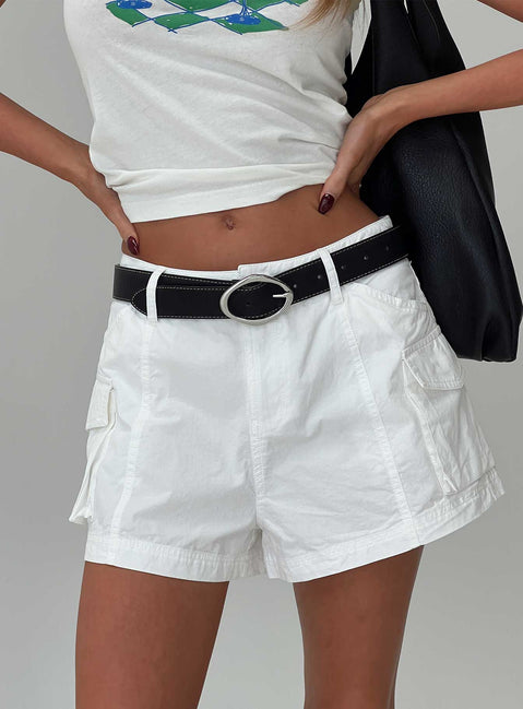 back view of model wearing Princess Polly Colonel Cargo Mini Short White Petite High Waisted Shorts 