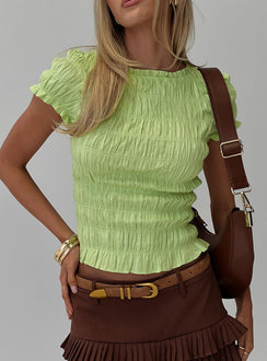 front view of model wearing Princess Polly Romelle Shirred Top Lime Short Sleeves High Neck 