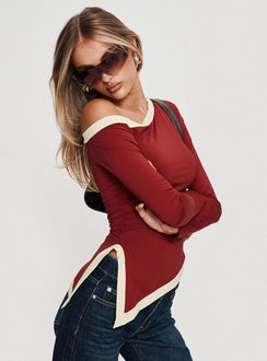 side view of model wearing Princess Polly Fake Smile Long Sleeve Top Burgundy / Cream Full Sleeves Asymmetric Neckline 
