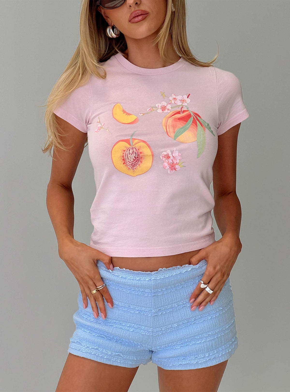 front view of model wearing Princess Polly Darlin' Peach Graphic Top Pink Short Sleeves Crew Neck 