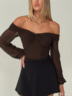 Shop the Babette Off The Shoulder Bodysuit in Brown womens-bodysuit with ruched detailing and full sleeves side view of model wearing