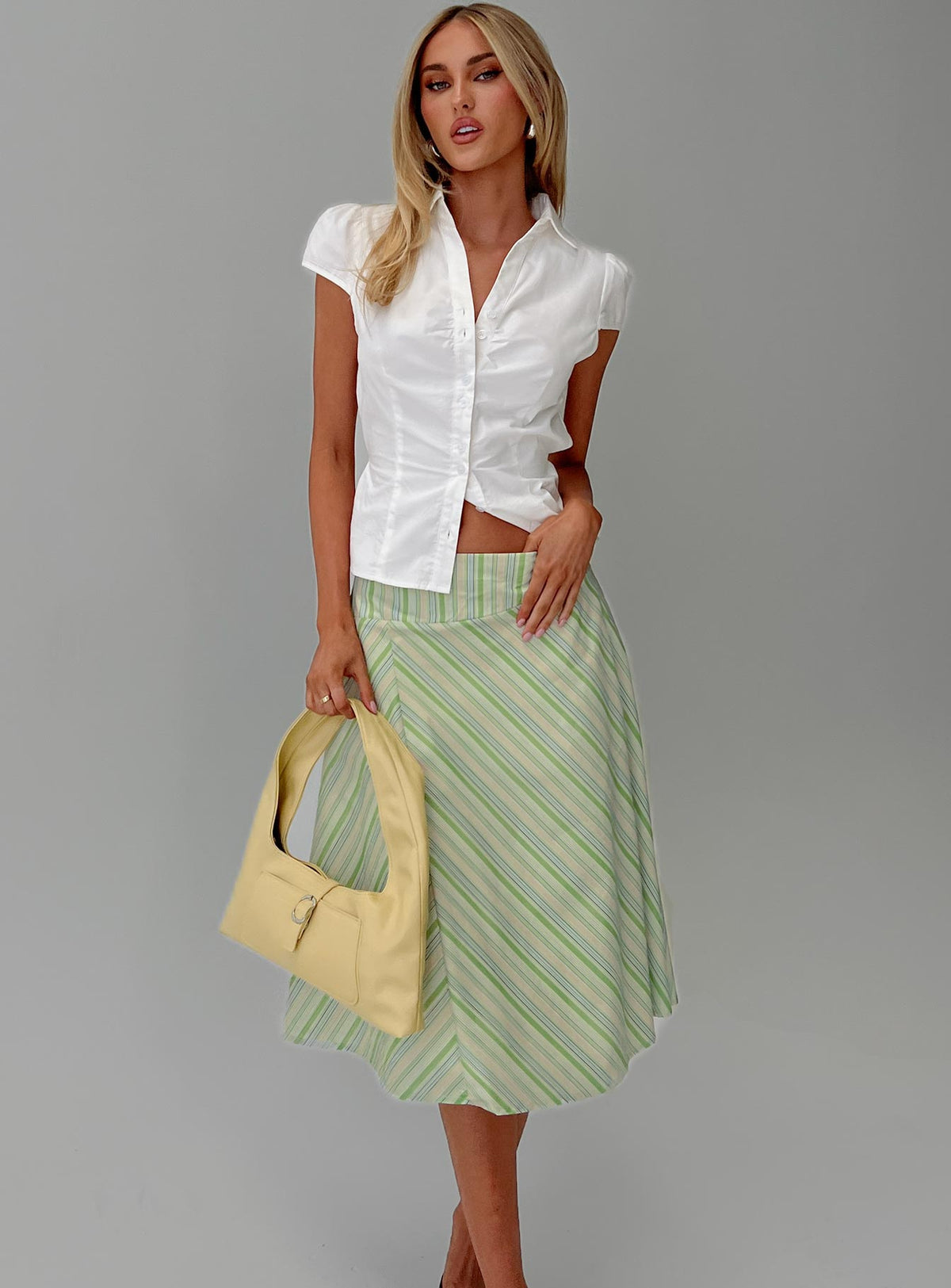   side view of model wearing Princess Polly Vettie Midi Skirt Green Multi Midi Skirts Skirts 