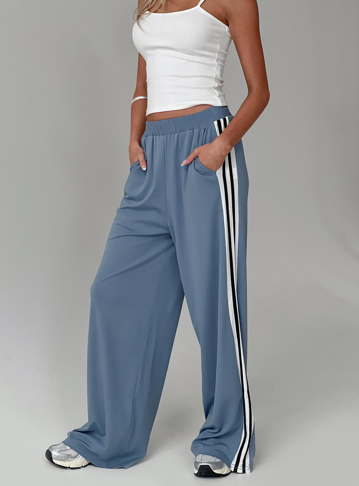 front view of model wearing Princess Polly Dime Track Pants Blue High Rise Pants Pants 