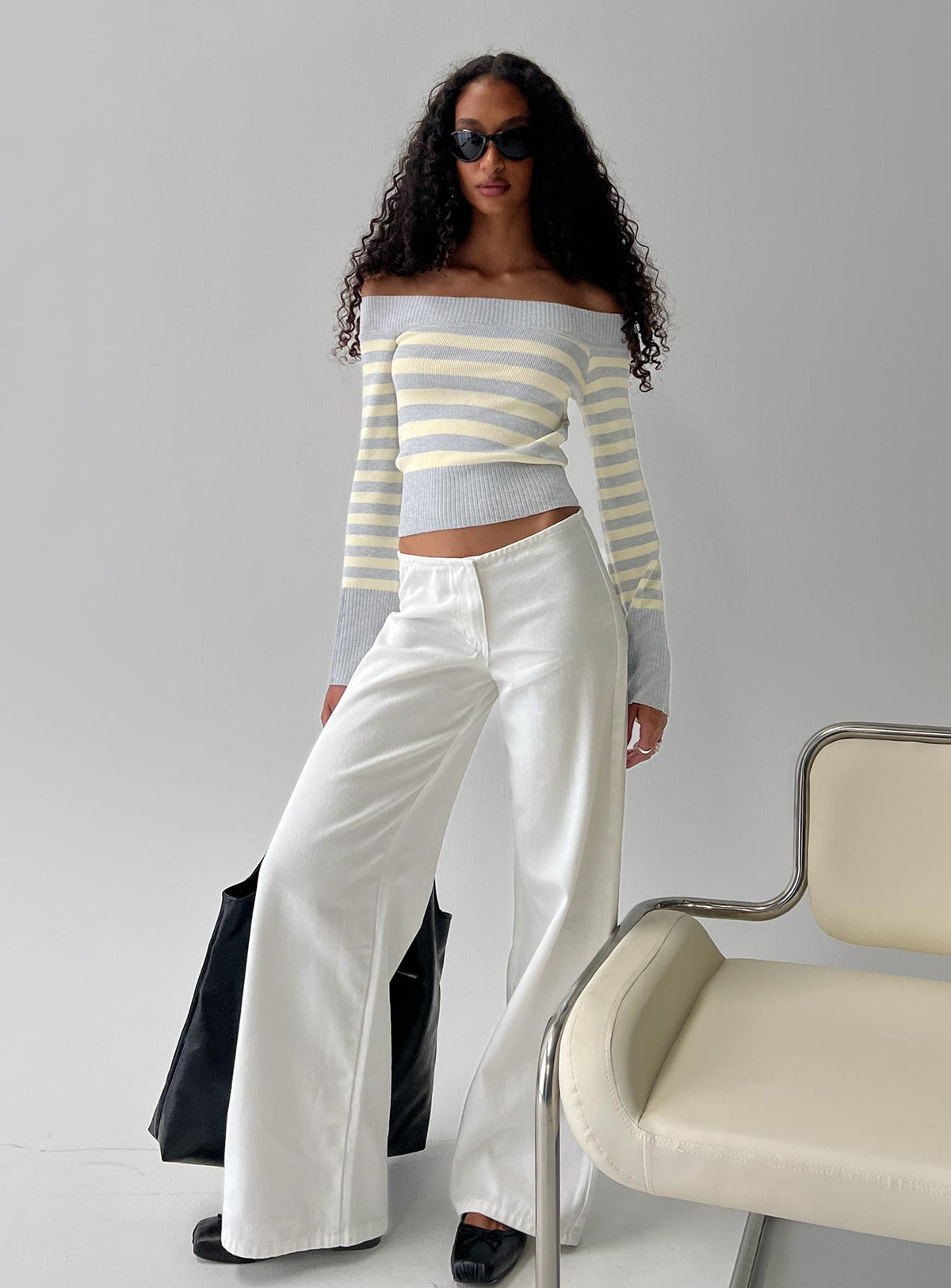 front view of model wearing Princess Polly Hereos Mid Rise Baggy Leg Jeans White Mid Rise Jeans Jeans 