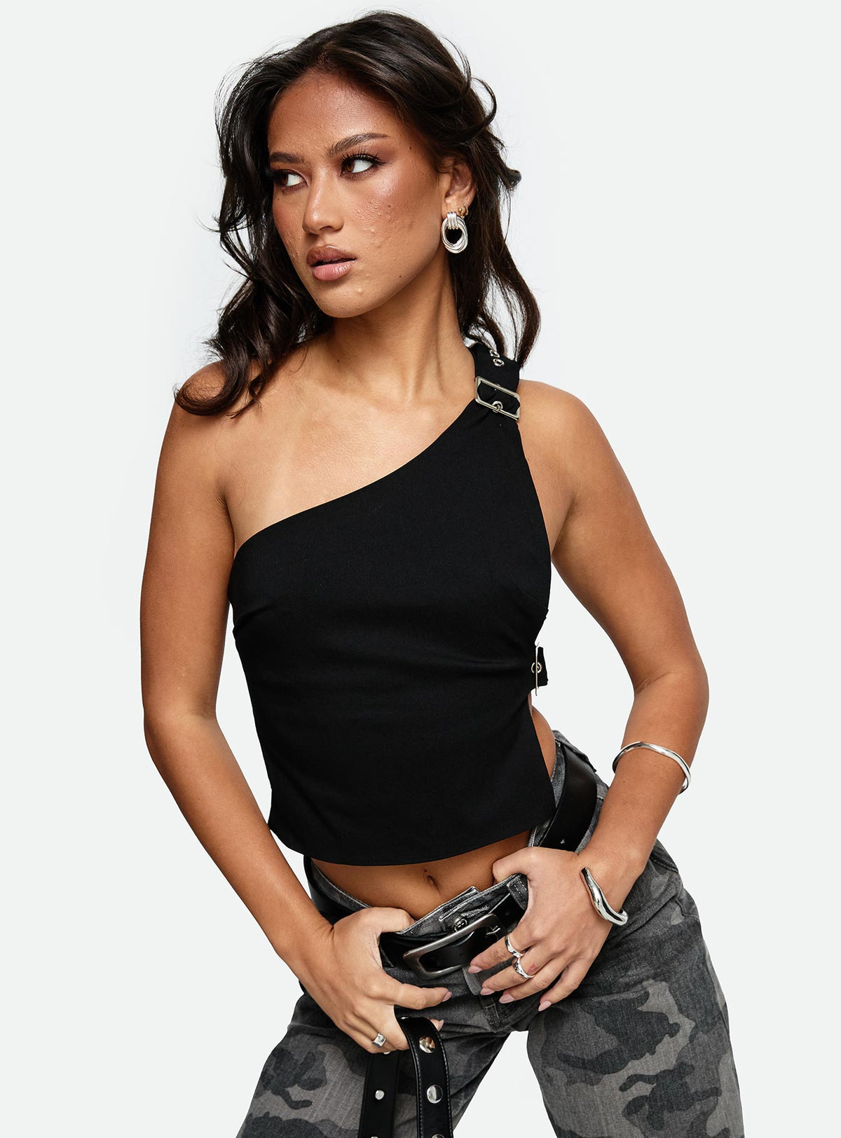 front view of model wearing Princess Polly Buckled Down One Shoulder Top Black Sleeveless Asymmetric Neckline 