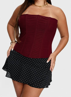   side view of model wearing Princess Polly Sonsie Mini Skirt Black / White Polka Curve Skirts 