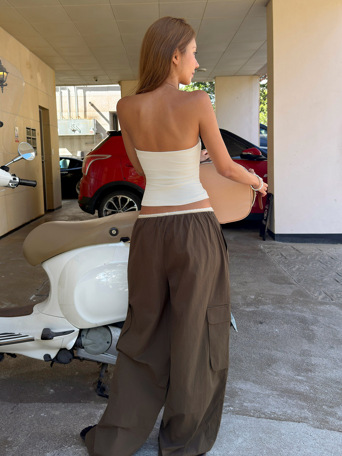 Showcasing the Lunea Concealed Waistband Cargo Pants Brown Petite in womens-regular-pants with mid-rise back view of model wearing Princess Polly