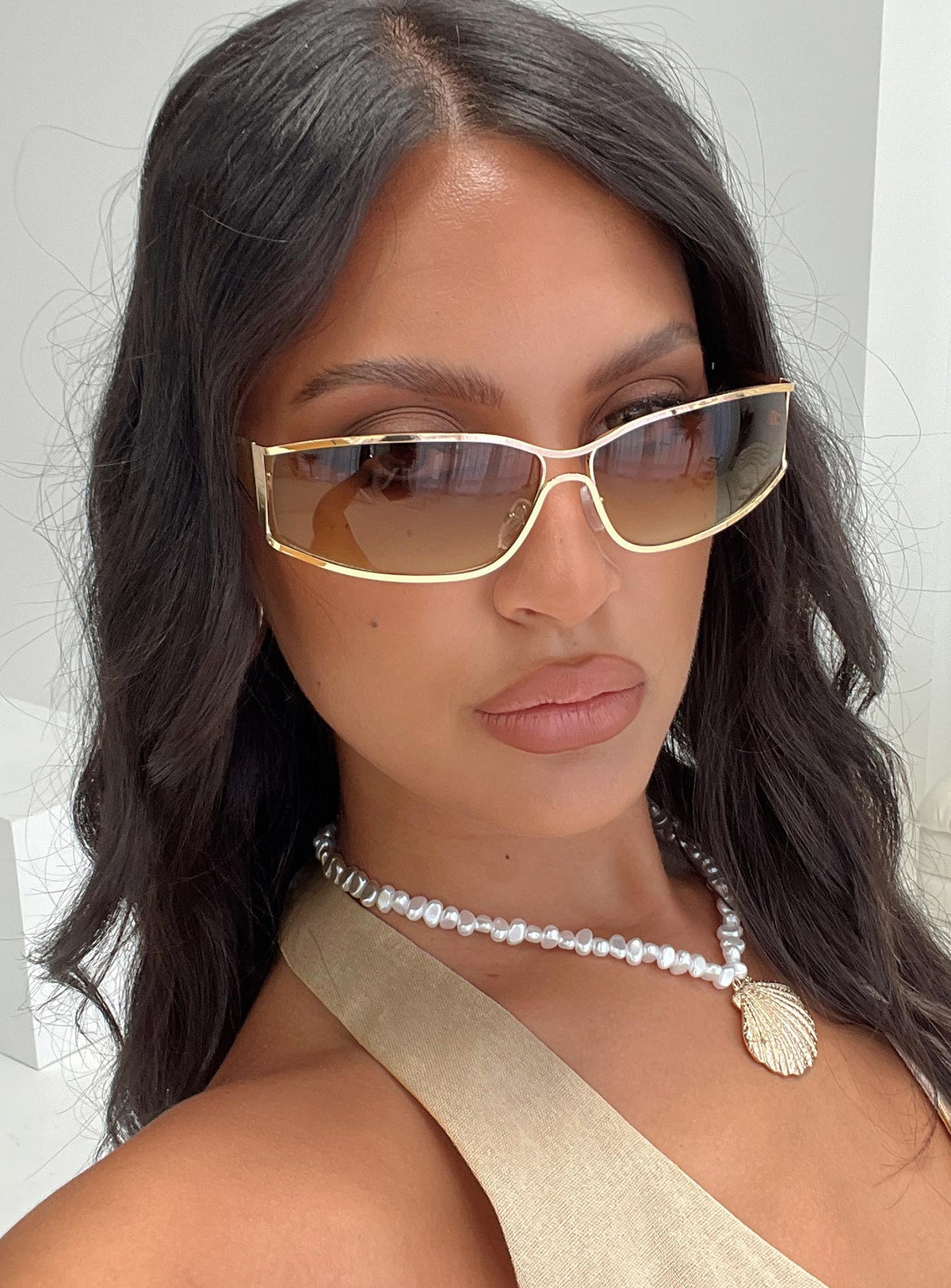 Gold-toned sunglasses Metal frame, brown tinted lenses, silicone nose pads