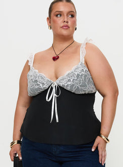 front view of model wearing Princess Polly Delvonte Top Black Curve Sleeveless Plunger 