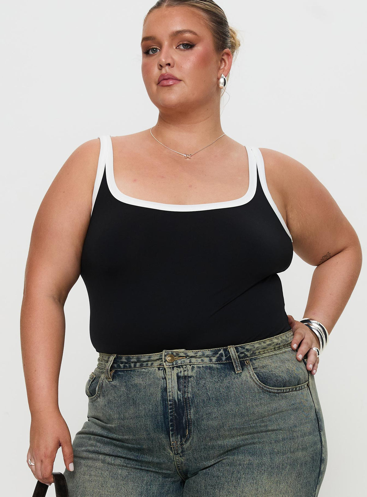 front view of model wearing Princess Polly Astrea Bodysuit Black / White Curve Sleeveless Bodysuit 