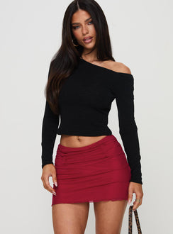   side view of model wearing Princess Polly Meredith Ruched Mini Skirt Red Mini Skirts Skirts 