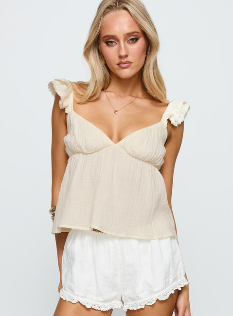 front view of model wearing Princess Polly On A Date Top Cream Sleeveless Plunger 