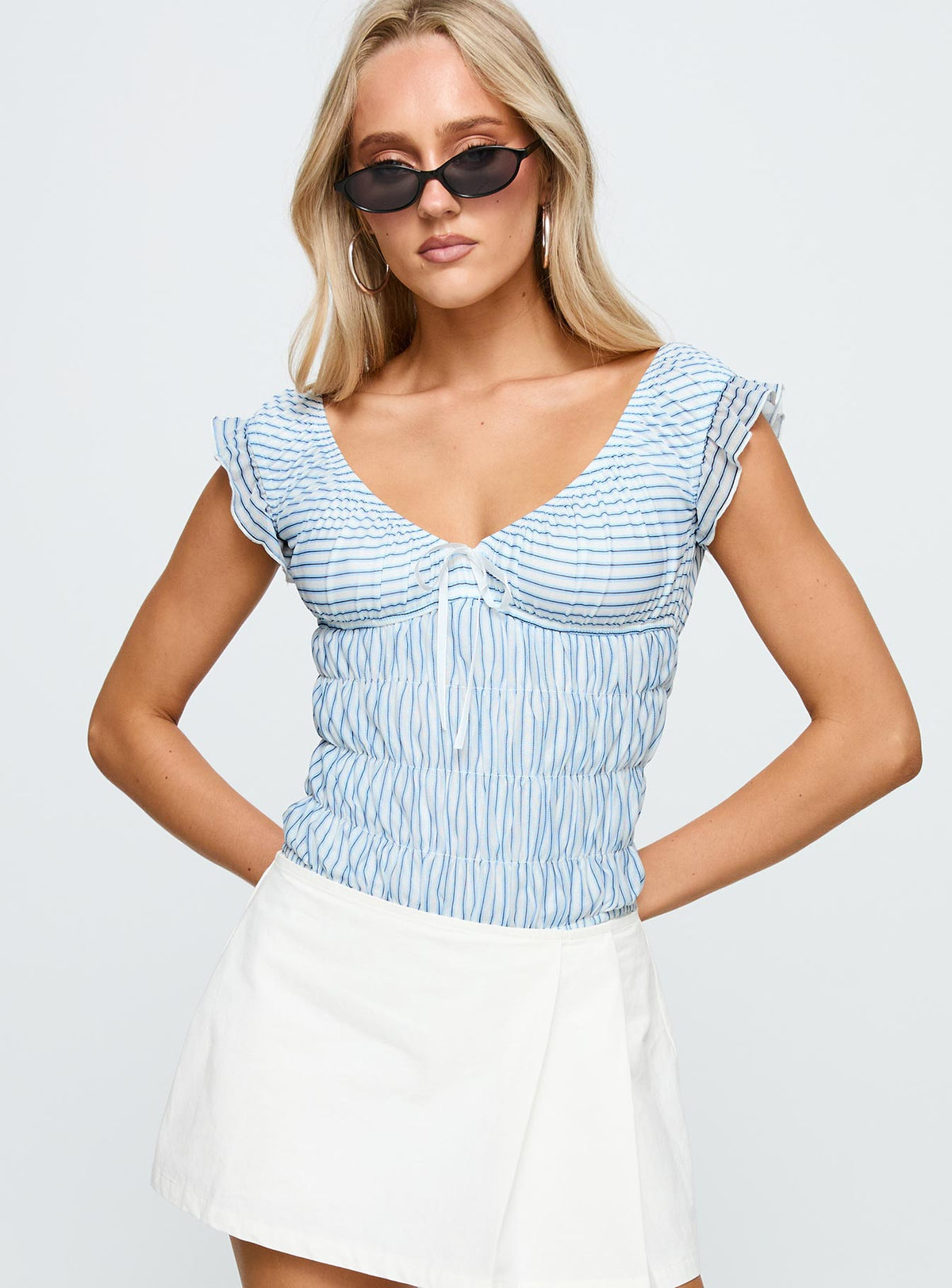 front view of model wearing Princess Polly Ahead Of Myself Off Shoulder Bodysuit Blue Stripe Short Sleeve Bodysuit 