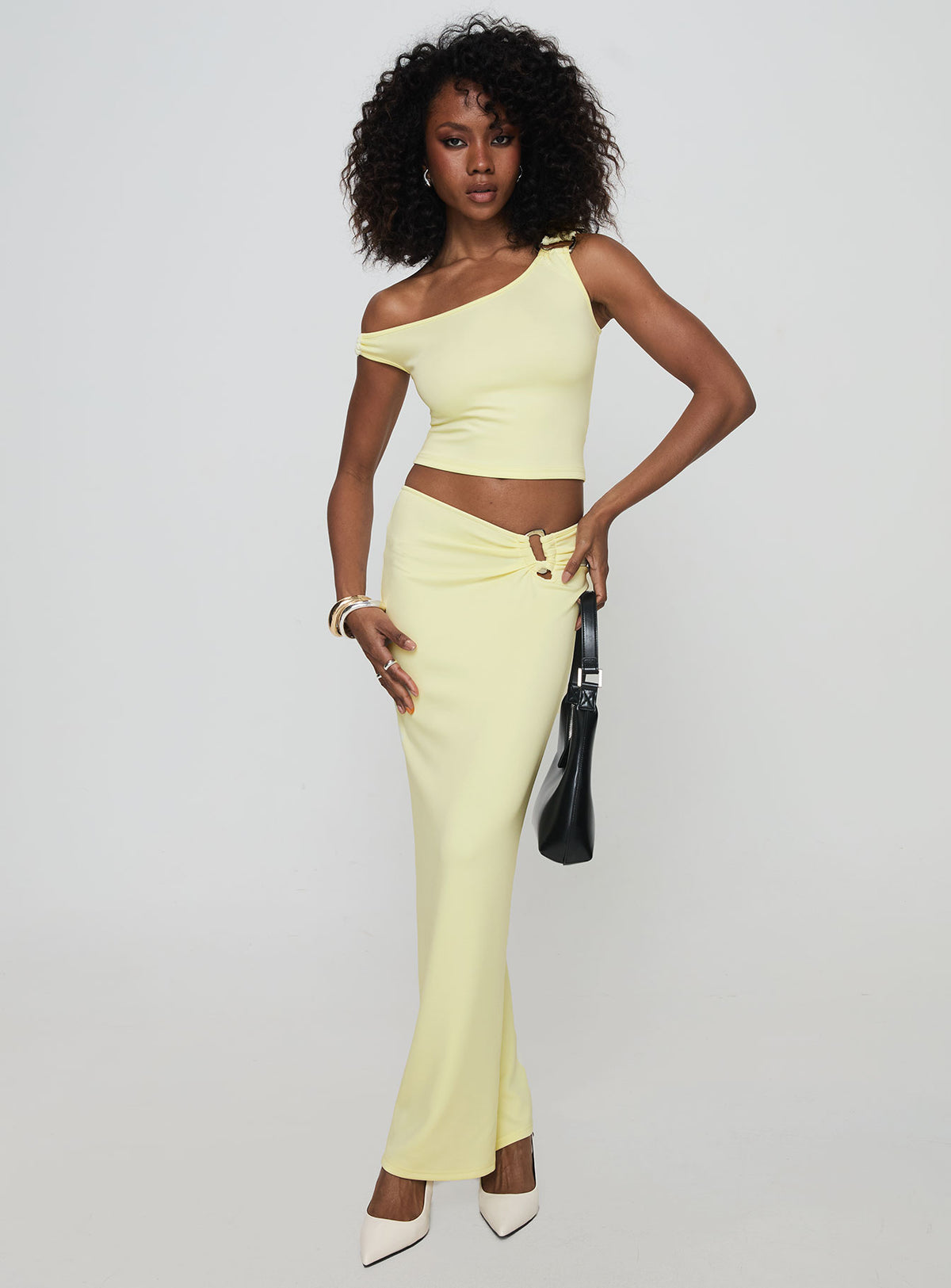   side view of model wearing Princess Polly Whiley Maxi Skirt Cream Maxi Skirts Skirts 