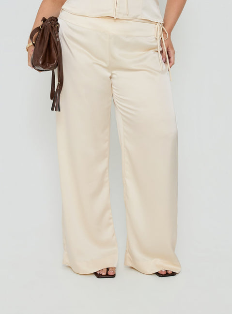 Showcasing the Aubrette Satin Tie Pants Cream Curve womens-regular-pants with high-rise, belt detail and wide-leg cut detail Princess Polly