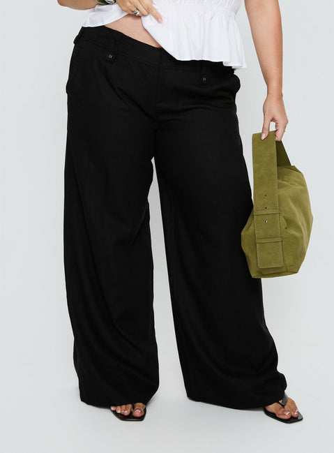 side view of model wearing Princess Polly Pedra Wide Leg Pant Black Curve Mid Rise Pants Pants 