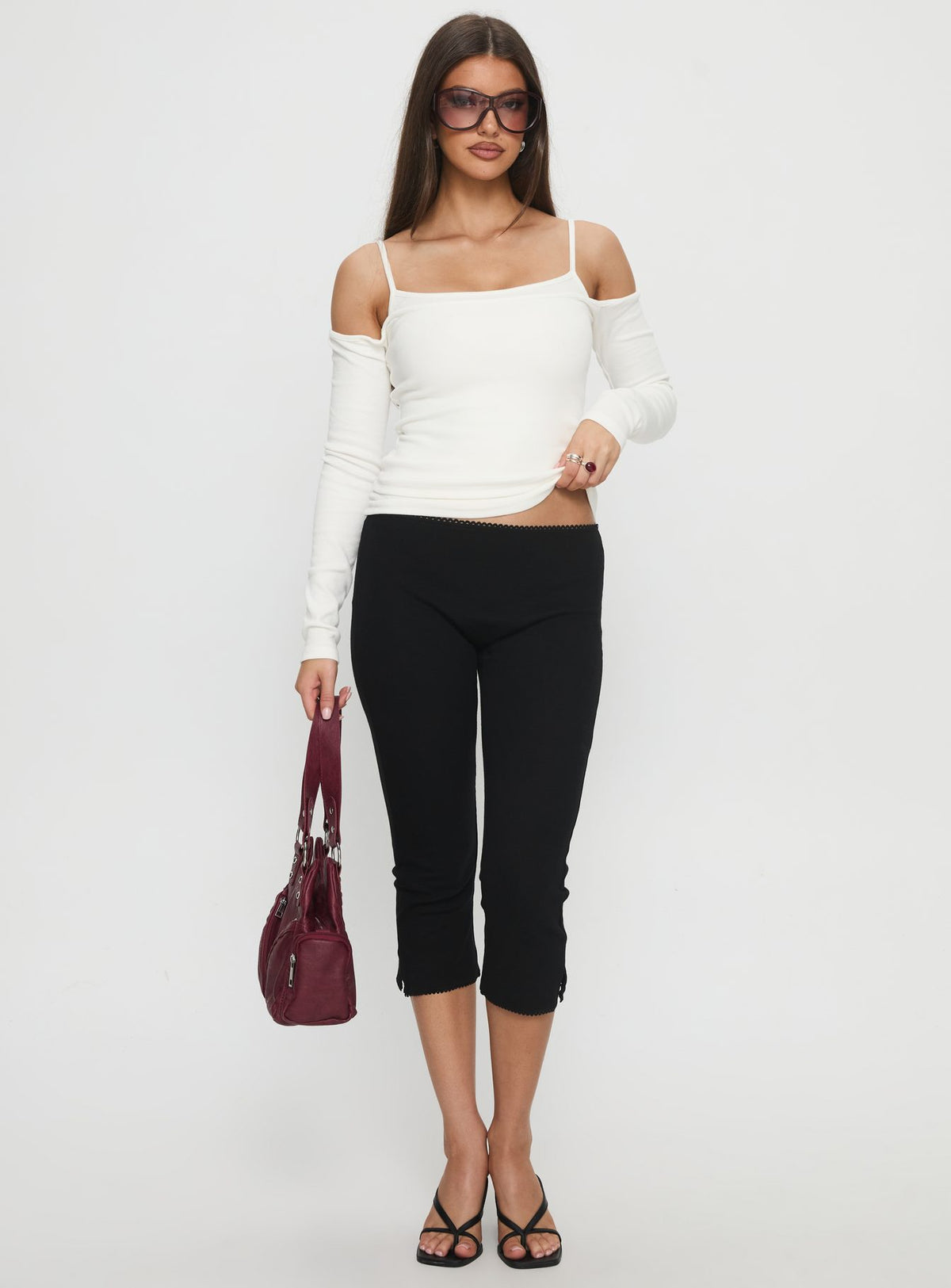 front view of model wearing Princess Polly Baseline Rib Capri Pants Black Tall Mid Rise Pants Pants 