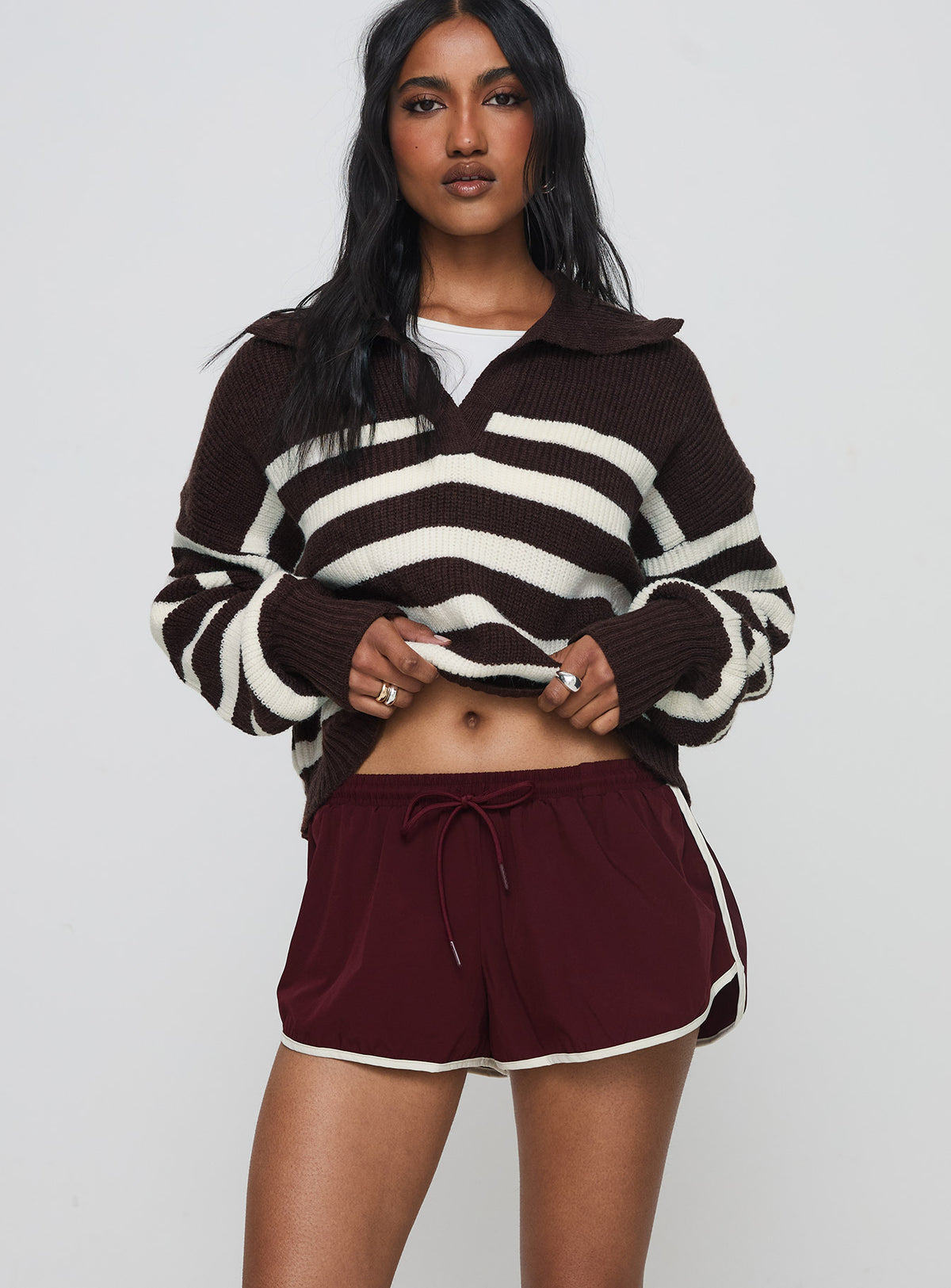 front view of model wearing Princess Polly Moreton Shorts Wine Low Rise Shorts 