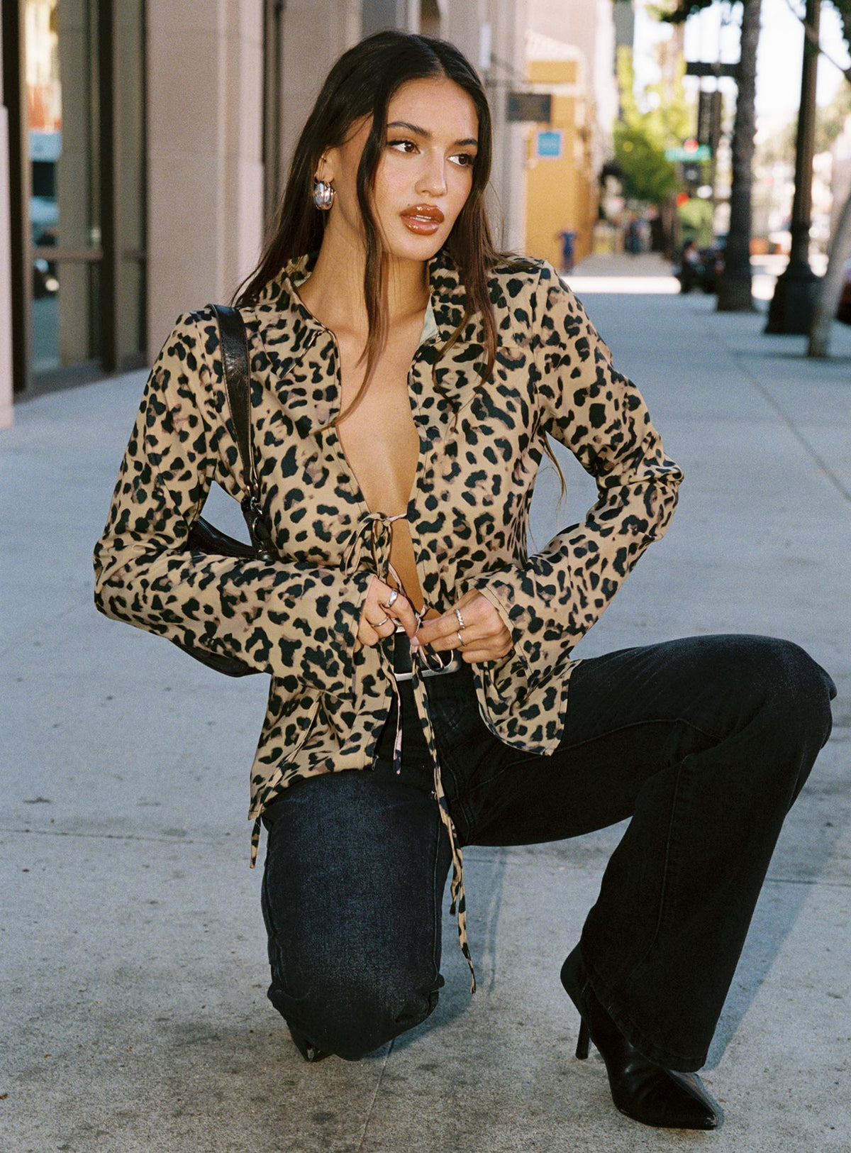 front view of model wearing Princess Polly Toriah Long Sleeve Tie Up Top Leopard Full Sleeves Plunger 