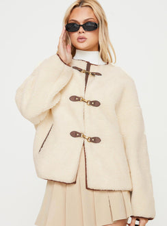 Teddy coat Relaxed fit, twin hip pockets, drop shoulder  Gold-toned clasp fastening down front 
