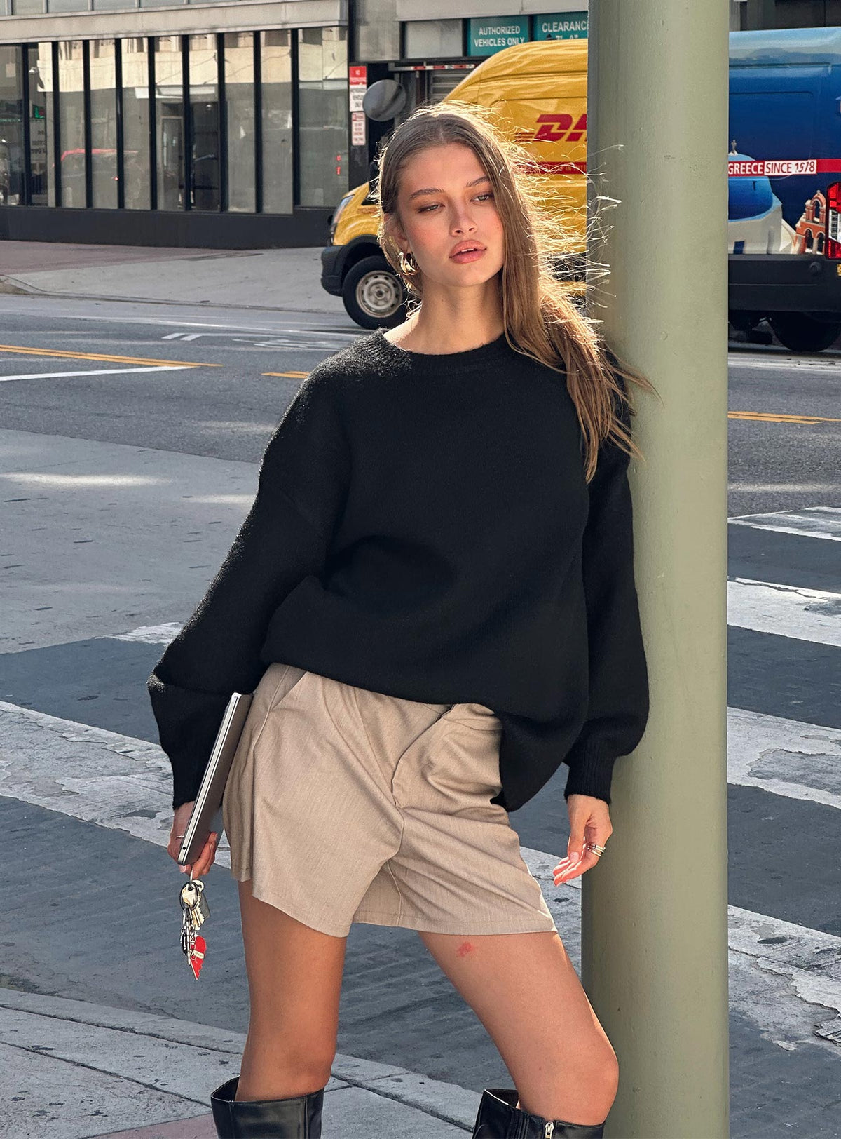 Showcasing the Ryanna Sweater Black womens-jumpers with long length and oversized fit front view of model wearing Princess Polly