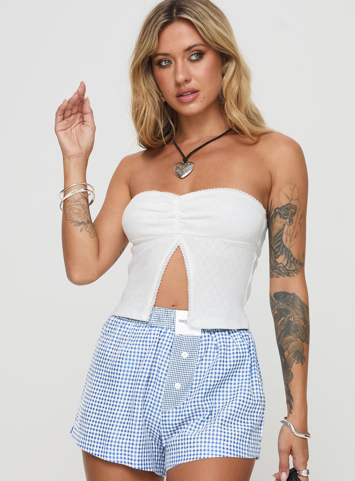 front view of model wearing Princess Polly Brekke Strapless Top White Sleeveless Sweetheart 