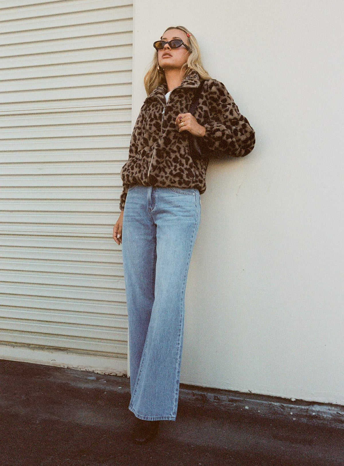 back view of model wearing Princess Polly Colemane Mid Rise Flared Jeans Angel Blue High Rise Jeans Jeans 