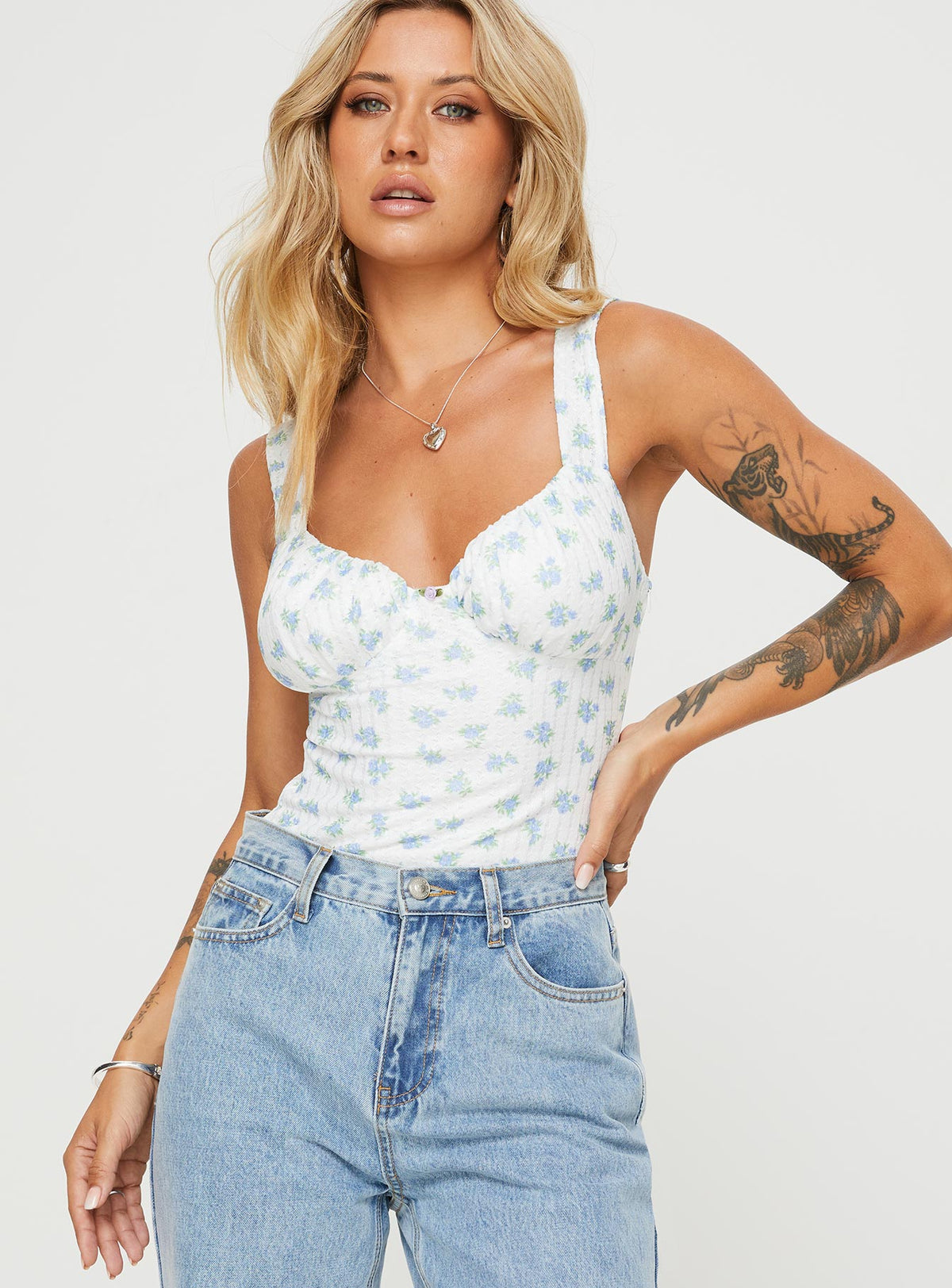 front view of model wearing Princess Polly Lupton Bodysuit White / Blue Floral Sleeveless Bodysuit 