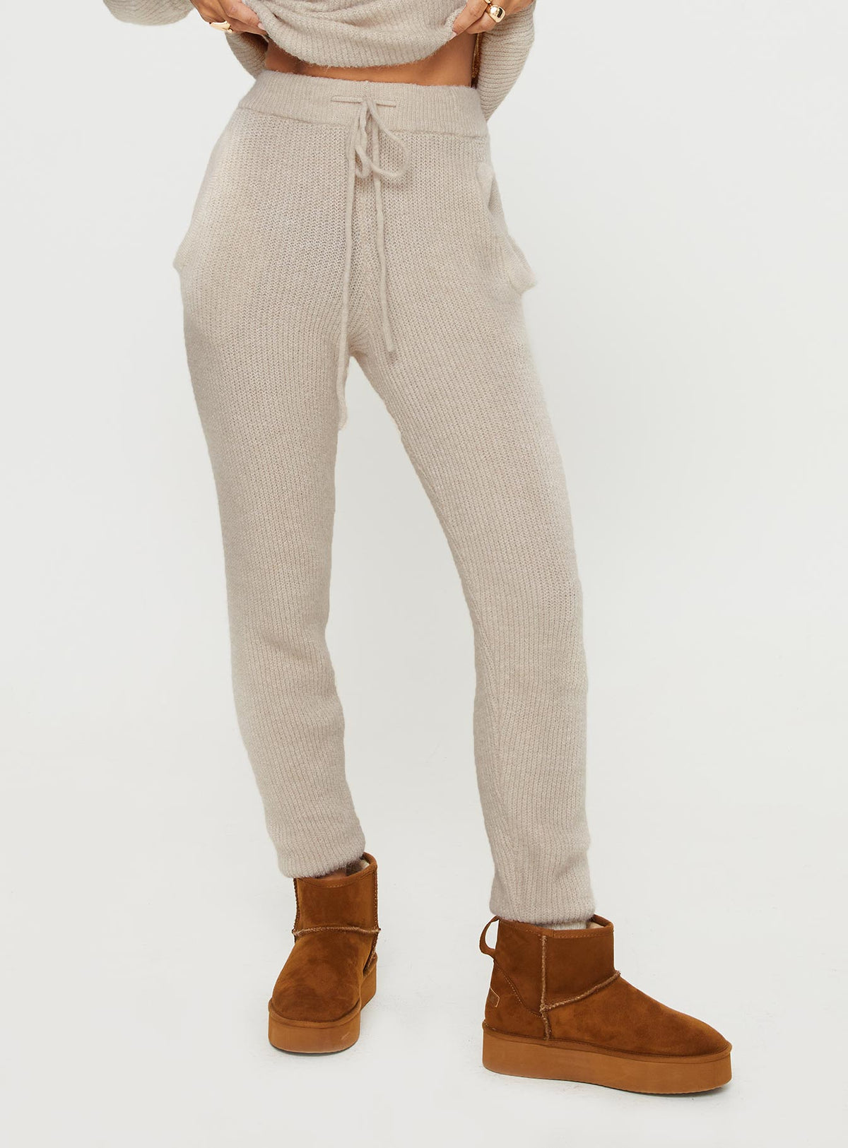 back view of model wearing Princess Polly Abrams Rib Knit Pant Beige High Rise Pants Pants 