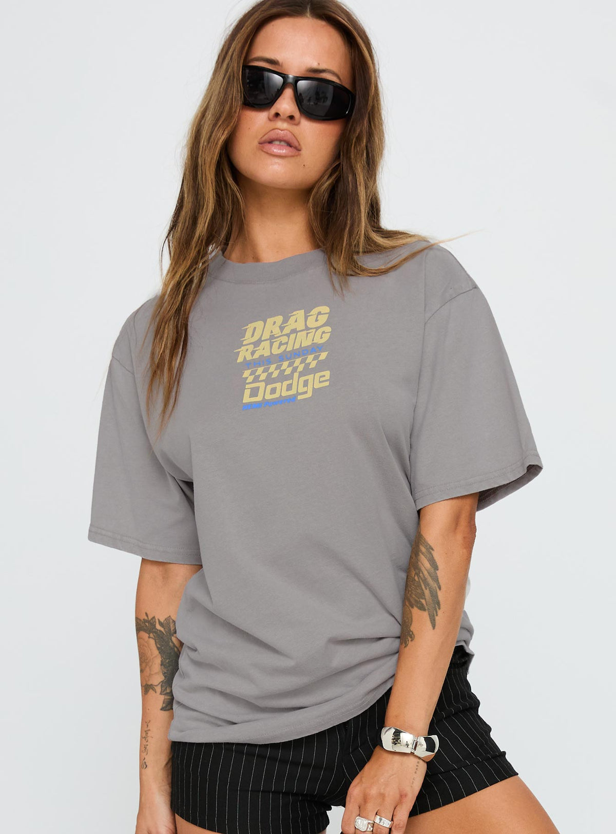 front view of model wearing Princess Polly Dodge Racer Oversized Graphic Tee Grey Half Sleeves Crew Neck 