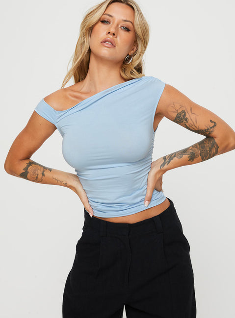 front view of model wearing Princess Polly Beller Top Blue Sleeveless Asymmetric Neckline 