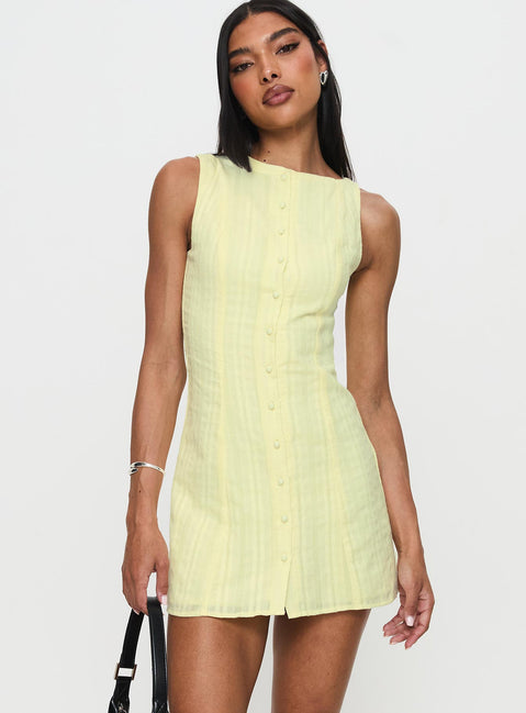 side view of model wearing Princess Polly Mimsie Embroidered Mini Dress Lemon Boat Neck 