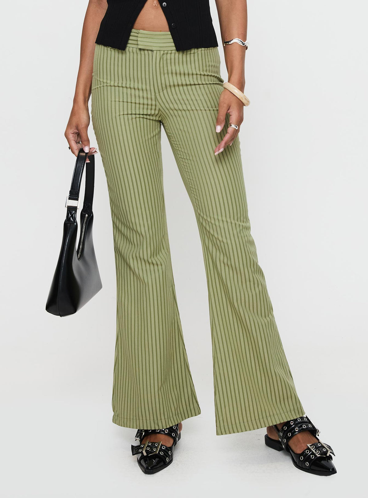 side view of model wearing Princess Polly Jinxed Pant Green Stripe Pants 
