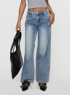 side view of model wearing Princess Polly Skipper Low Rise Wide Leg Jeans Vintage Blue Low Rise Jeans Jeans 